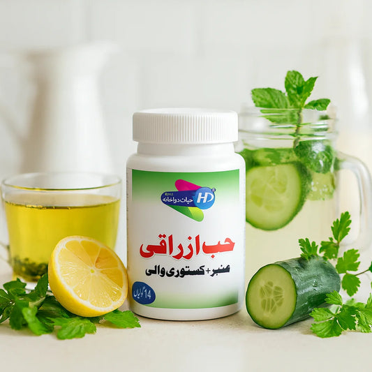 Hab e Azraqi Amber Kasturi Wali bottle placed with lemon, cucumber slices, mint leaves, and green herbal drink on a clean kitchen background – Hayat Dawakhana herbal remedy.