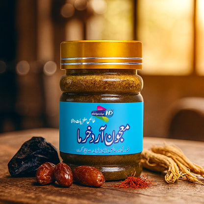 Majoon Ard Khurma jar by Hayat Dawakhana placed on a wooden surface with dates, saffron strands, ginseng roots, and a black herbal resin in the background.