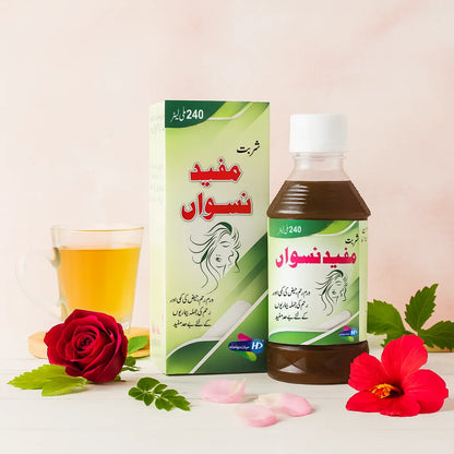 Mufeed e Niswan herbal syrup bottle and box with rose, hibiscus flower, green leaves, and a glass cup of tea.