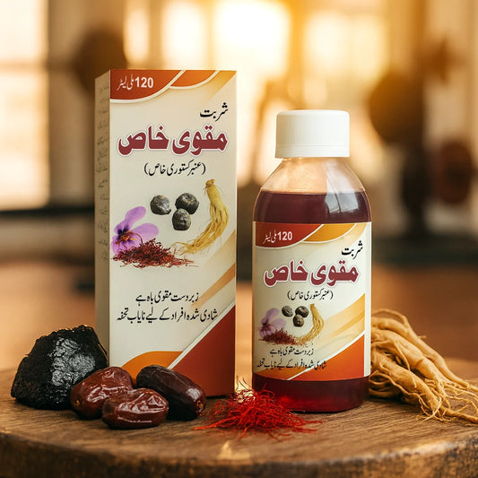 Sharbat Muqawi Khas Amber Kastori herbal tonic bottle and packaging displayed with saffron, dates, ginseng roots, and natural ingredients in a warm indoor setting.